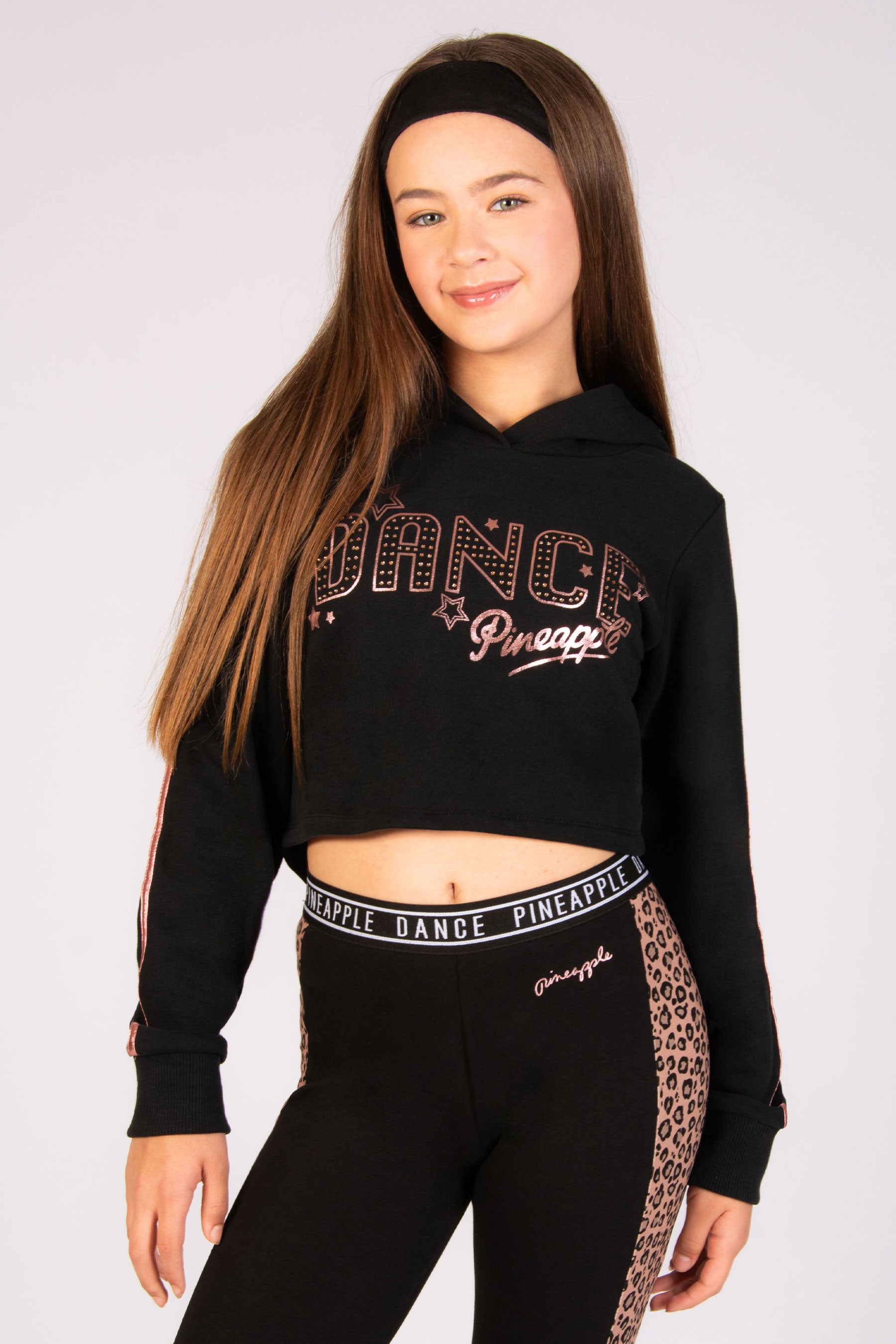 girls' black dance hoodie with rose gold stars and foil sleeve paneling by Pineapple Dance Studios