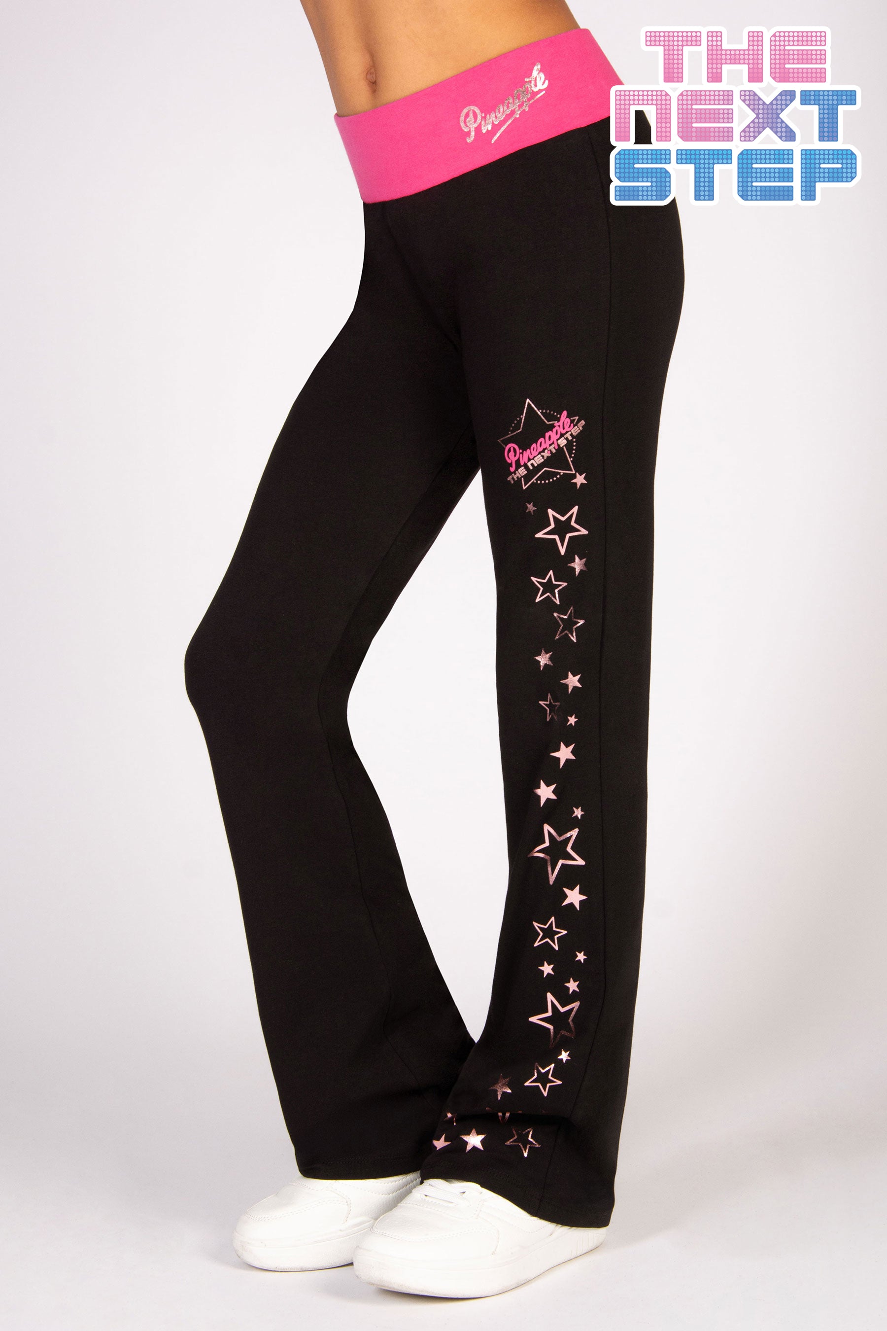 girls' black bootcut jersey trousers decorated with rose gold stars running down the leg and The Next Step logo