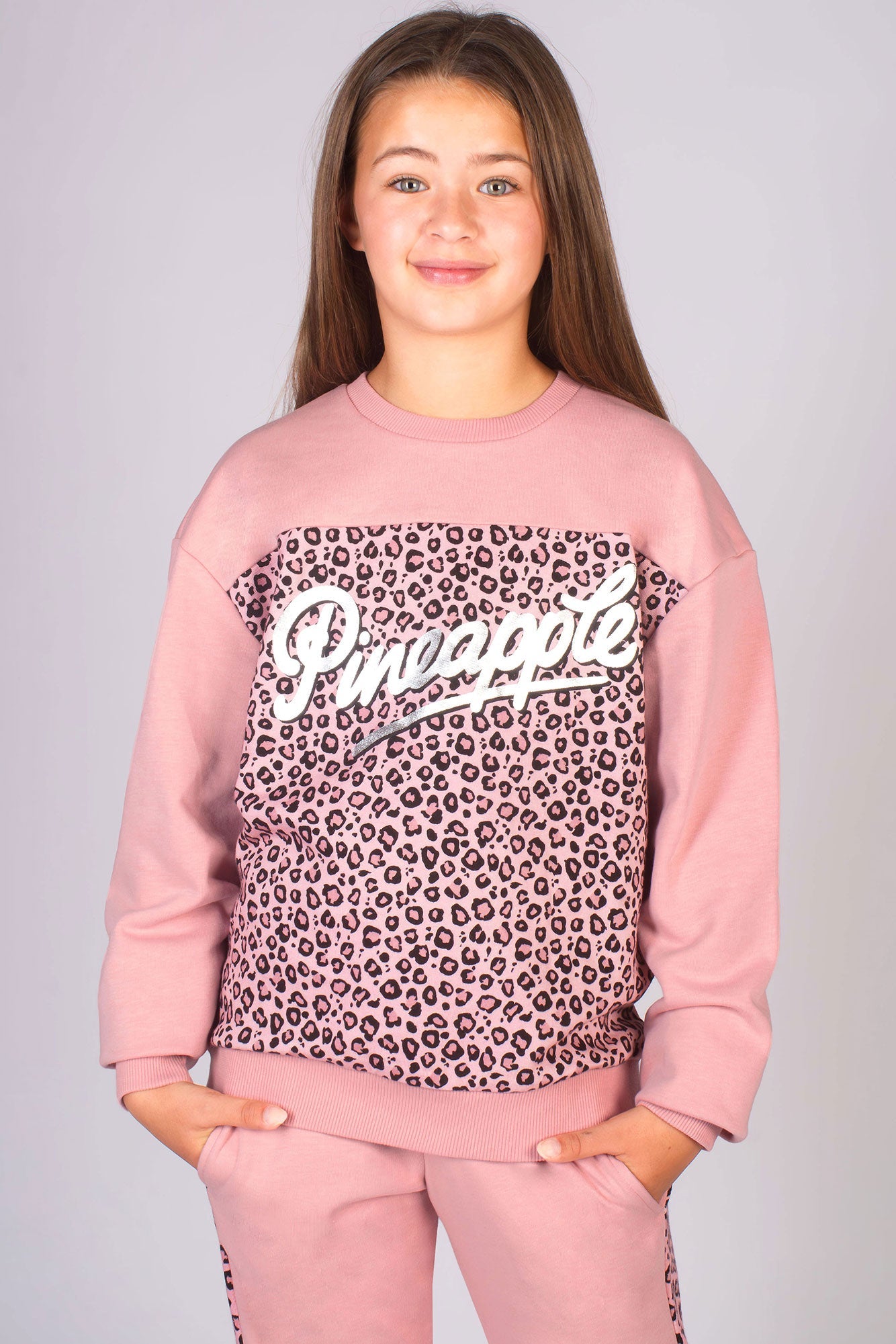 Dusty pink crewneck sweater for girls featuring pink leopard print and Pineapple Dance Studios logo across the chest in silver foil