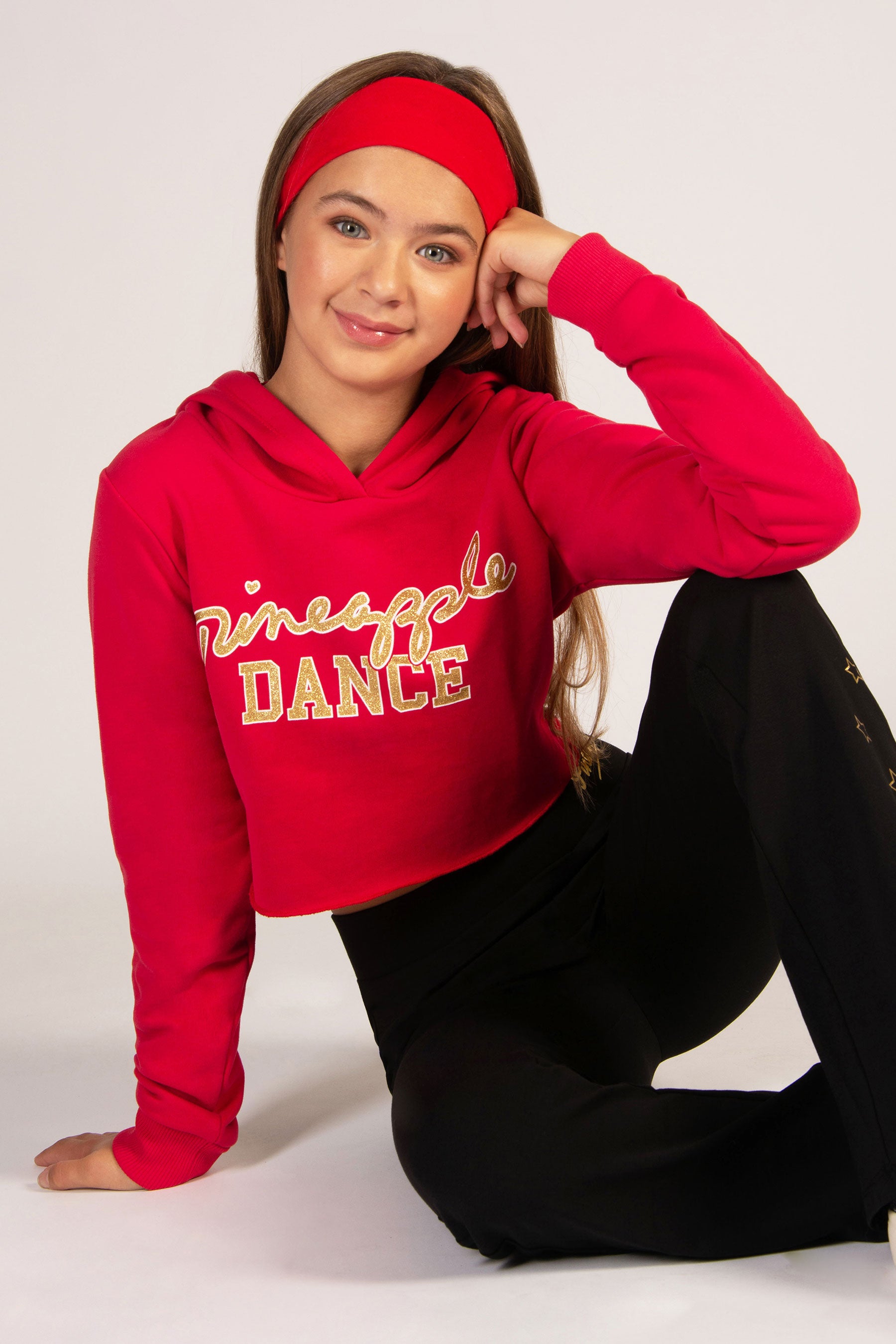 Pineapple dance red Christmas crop hoodie with sparkly gold foil chest print.