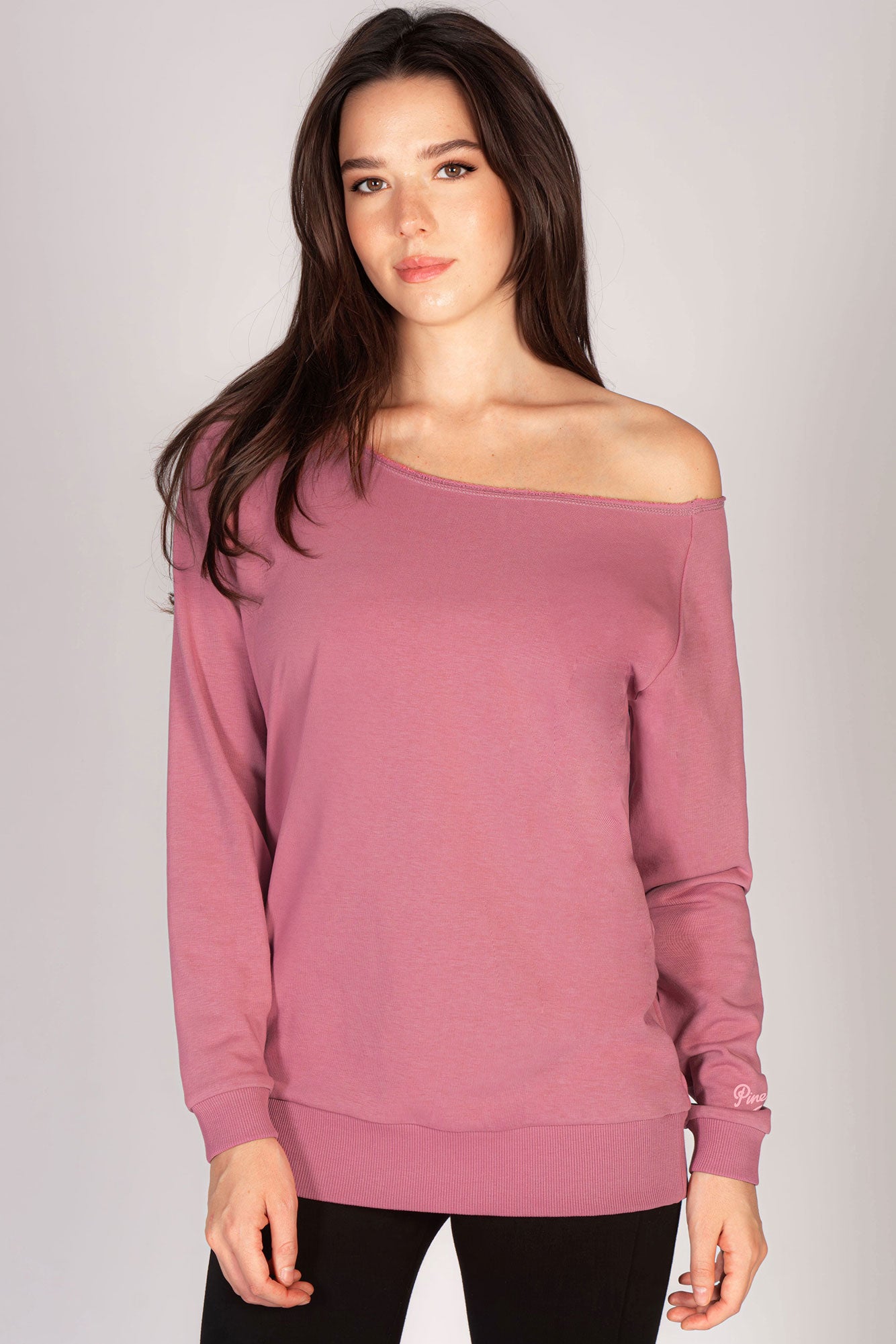 Martyna Balsam wearing pink off shoulder sweater by Pineapple Dance studios.