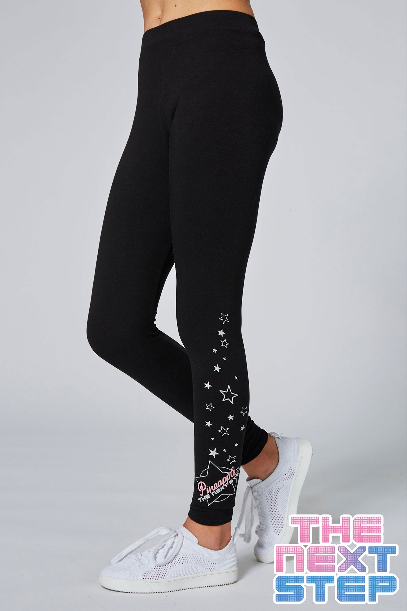 Girl wearing Pineapple x The Next Step Black Star Leggings