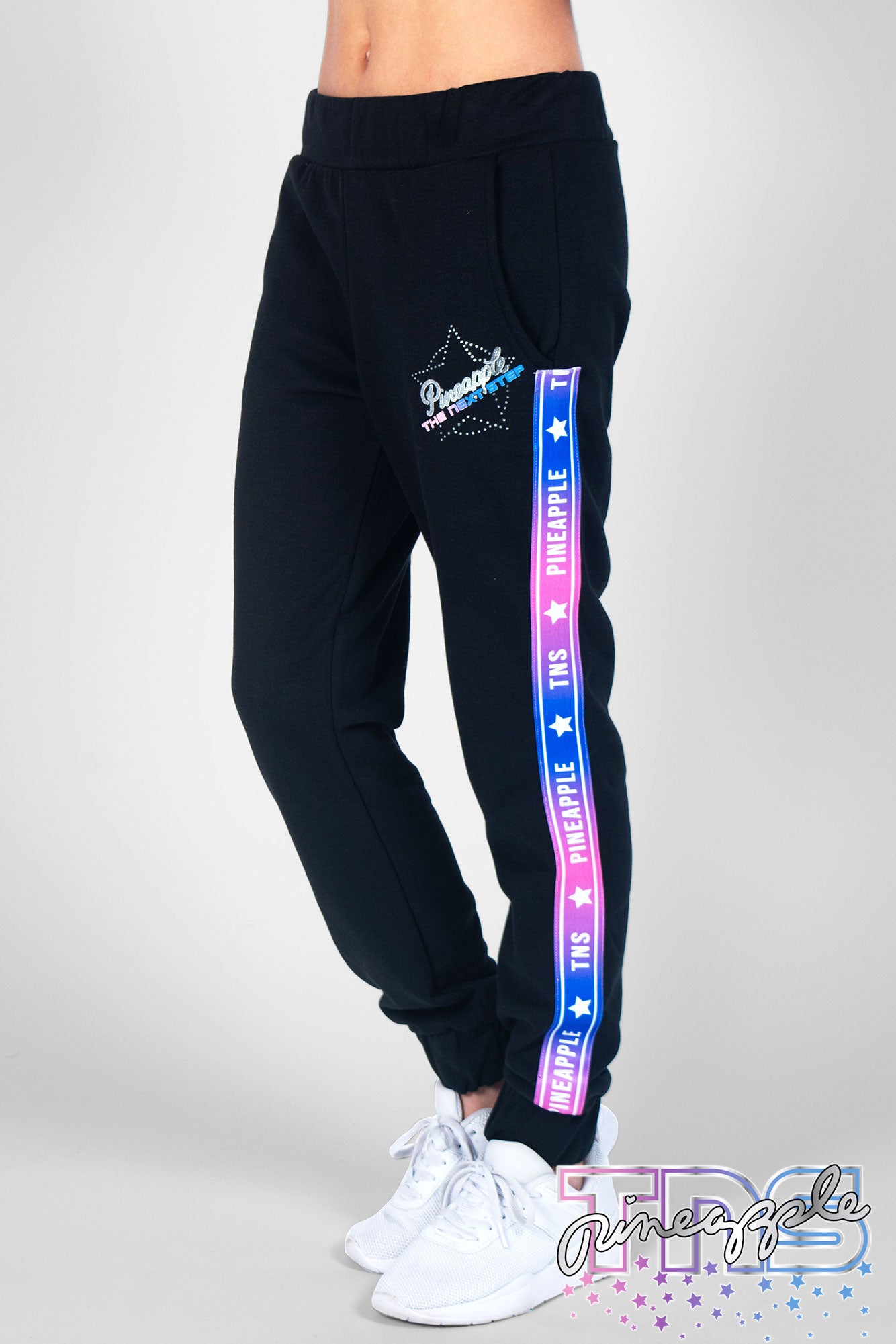 Girl wearing Black Pineapple x TNS Tape Joggers