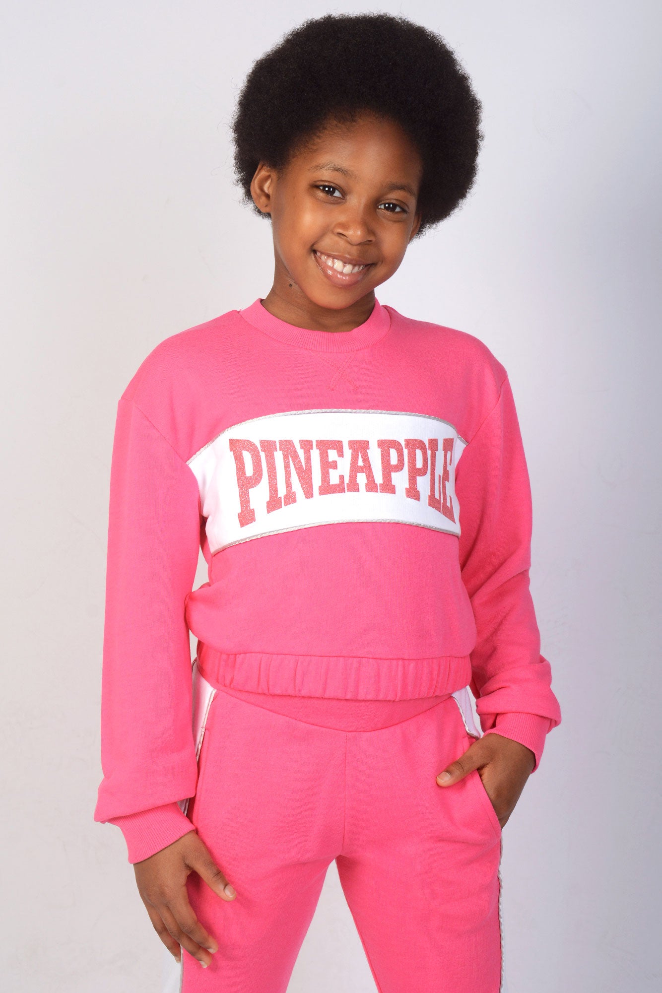 Girl wearing Pineapple Pink Logo Panel Sweat Top
