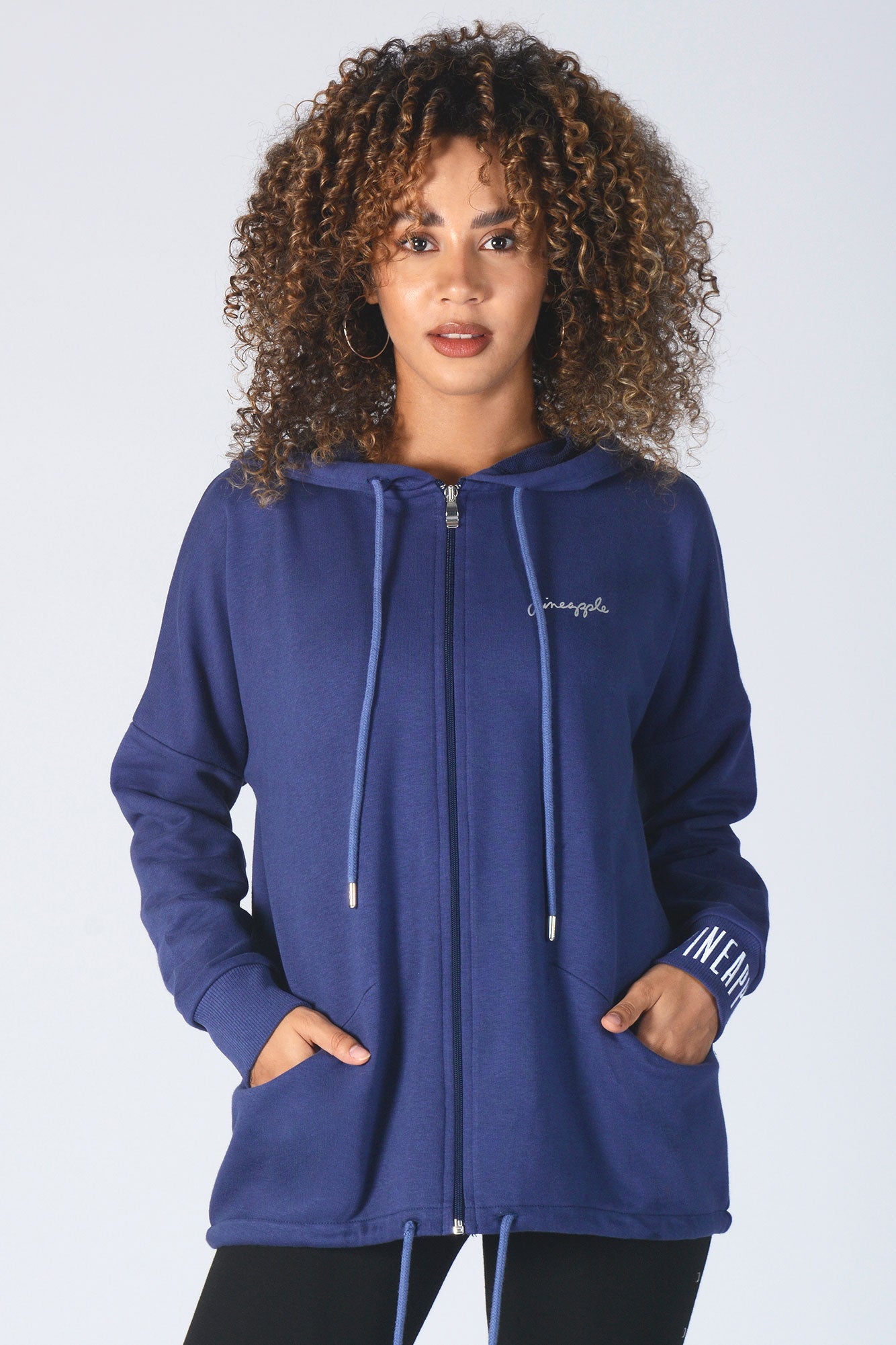 Woman wearing Pinepapple navy Parker Zip Jacket