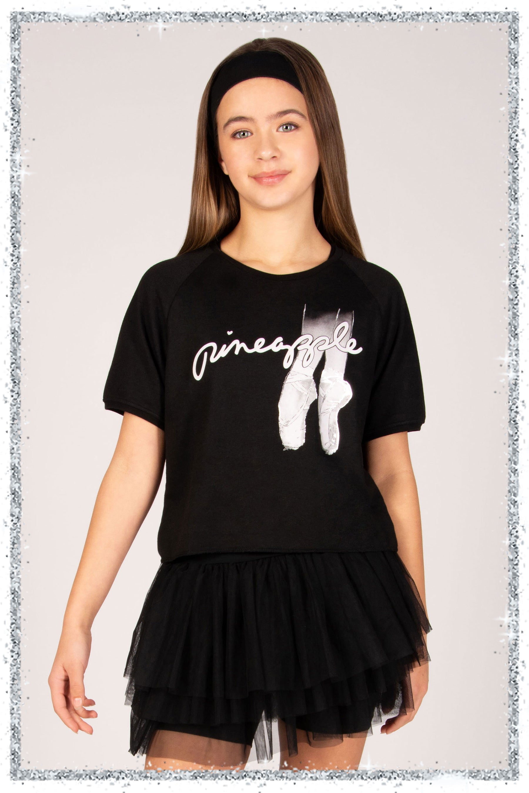 Person wearing a black t-shirt with white graphics and text on a plain background