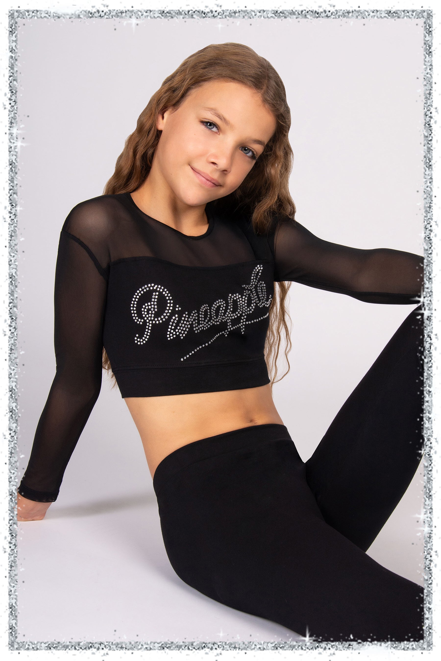 Person wearing a black outfit with 'Pineapple' text on a light gray background