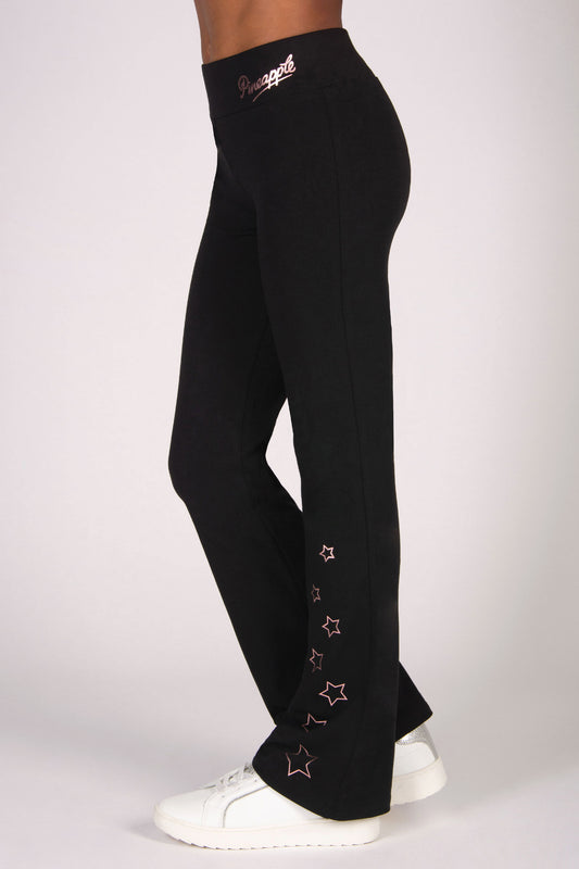 black flared leggings with rose gold foil star print running up the left leg.