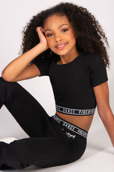 girls' black crop t-shirt with fitted tape hem.