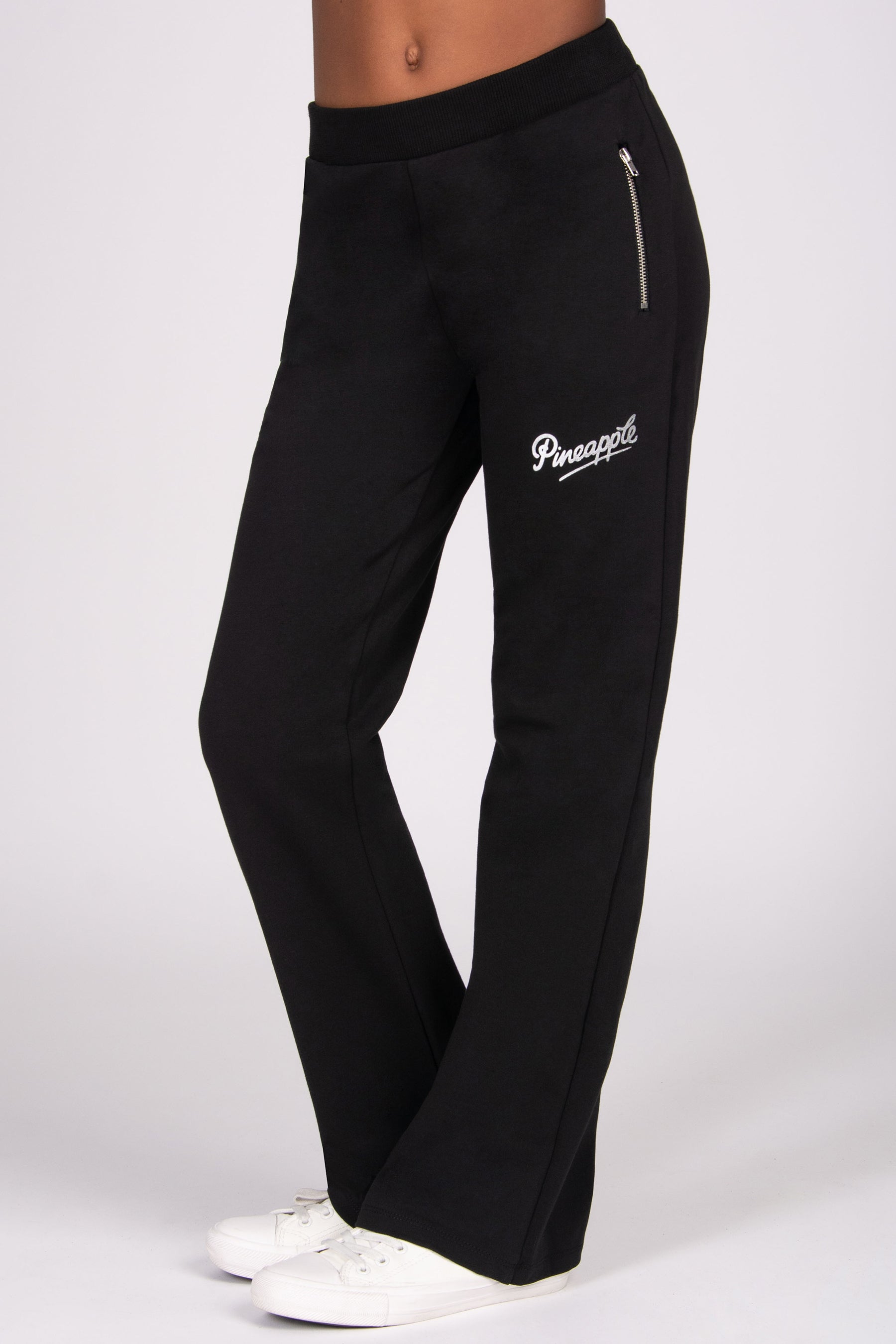 Kids' black sweatpants with a 'Pineapple' brand logo on a white background