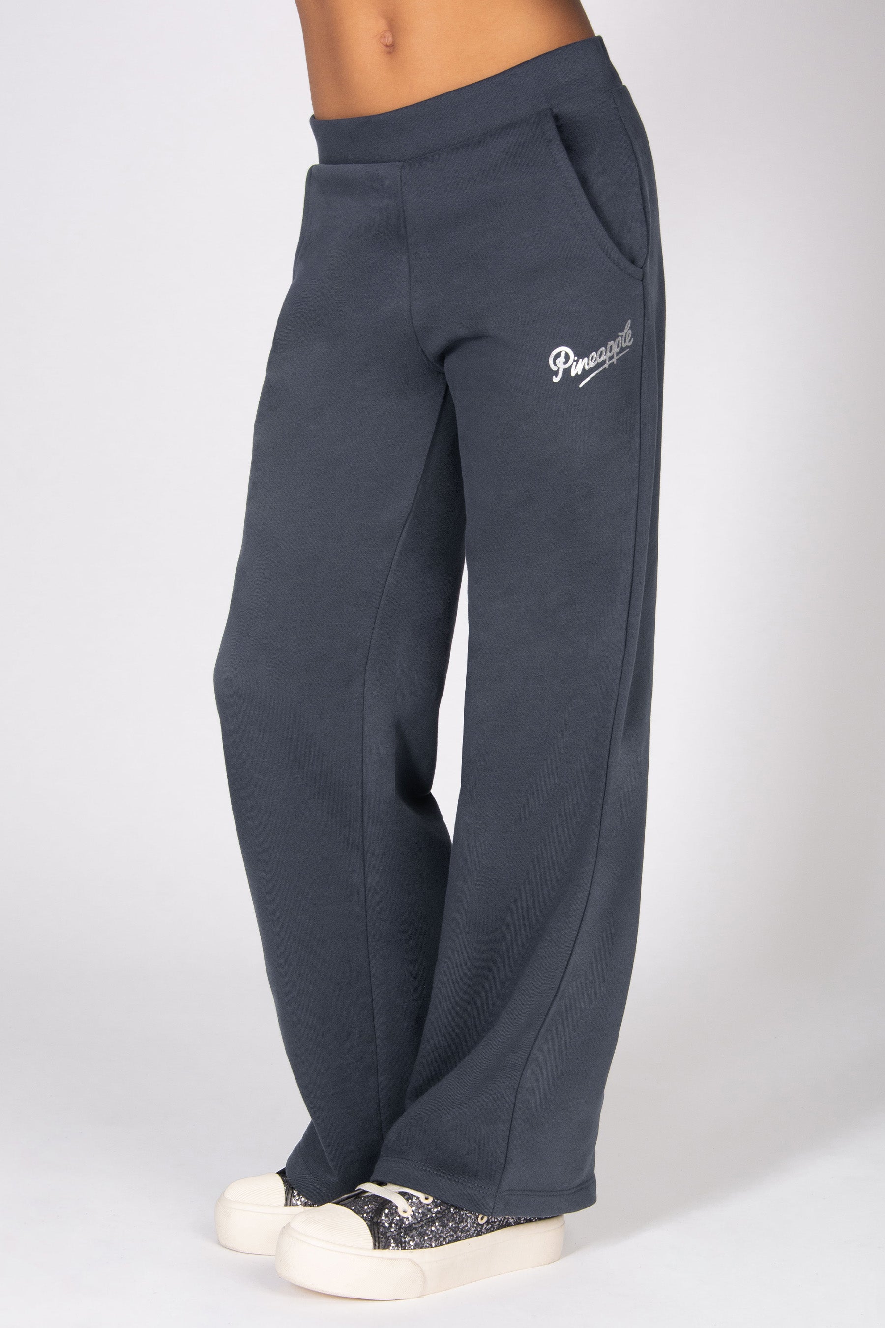 Dark grey sweatpants with a logo on a white background