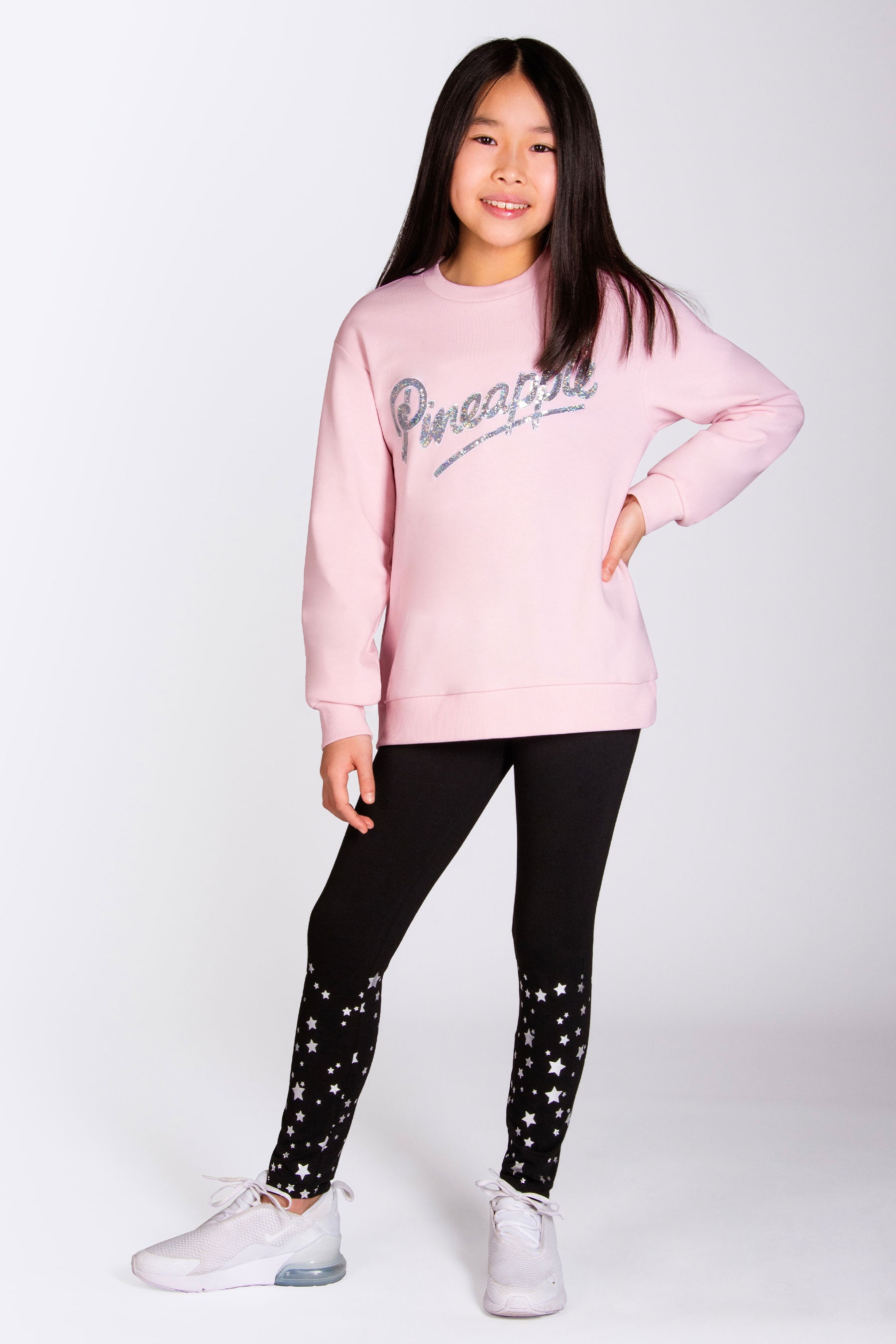 Baby pink sweater with sparkly sequin detail across the chest