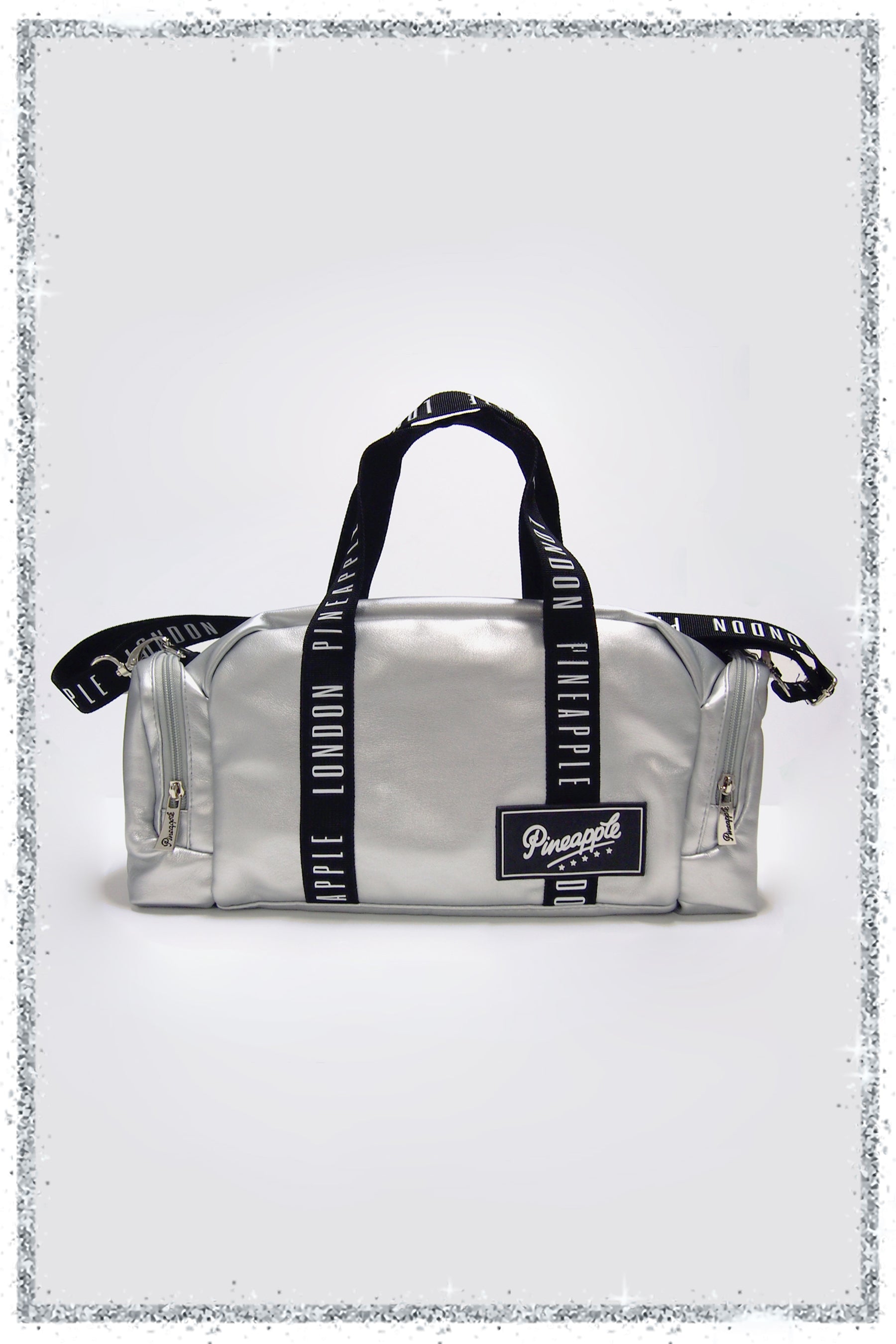 Silver duffel bag with black straps and a brand logo on a light gray background