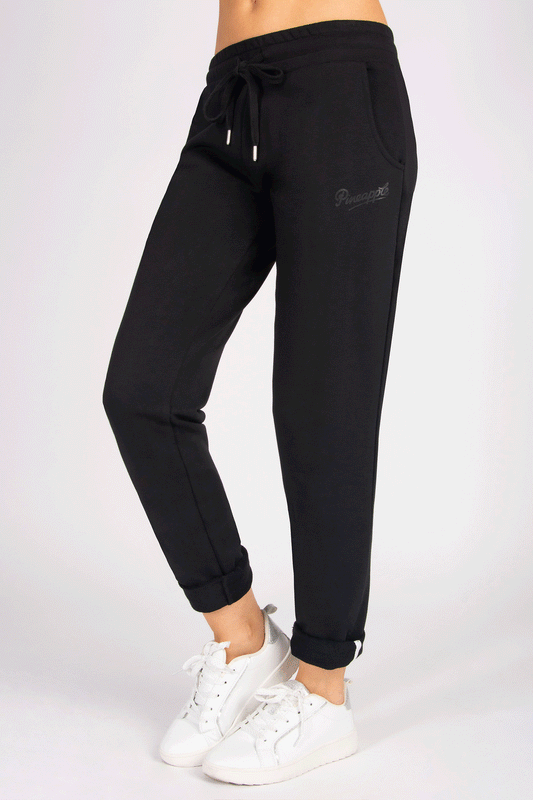 Black joggers with side pockets and waistband with drawcords on a person