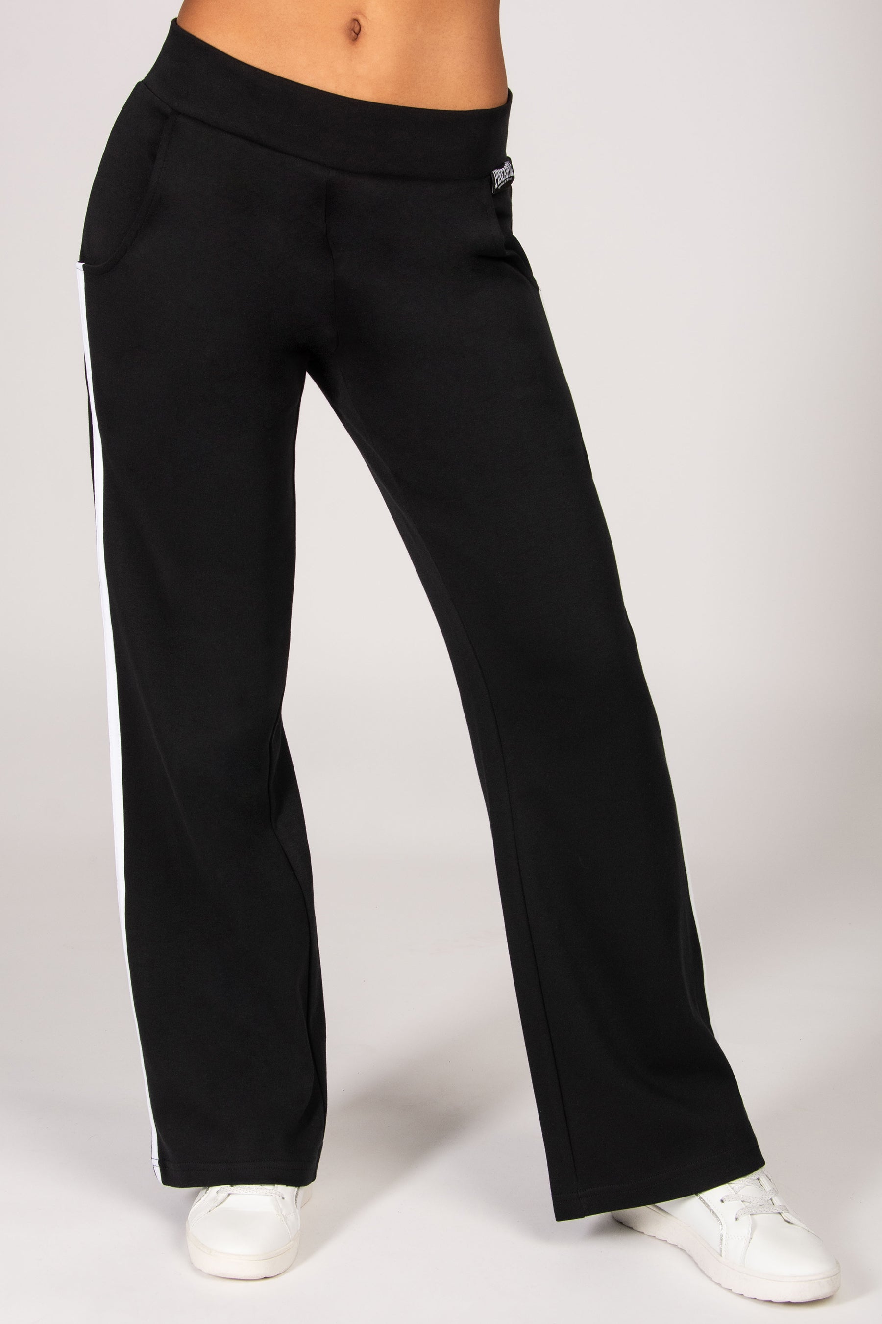 Black wide-leg pants worn by a person on a white background