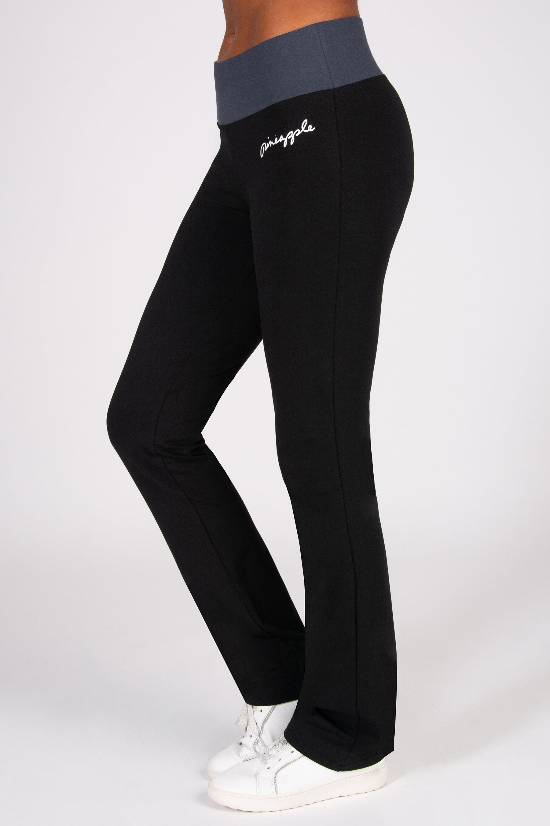 Black pants with gray waistband on a white background