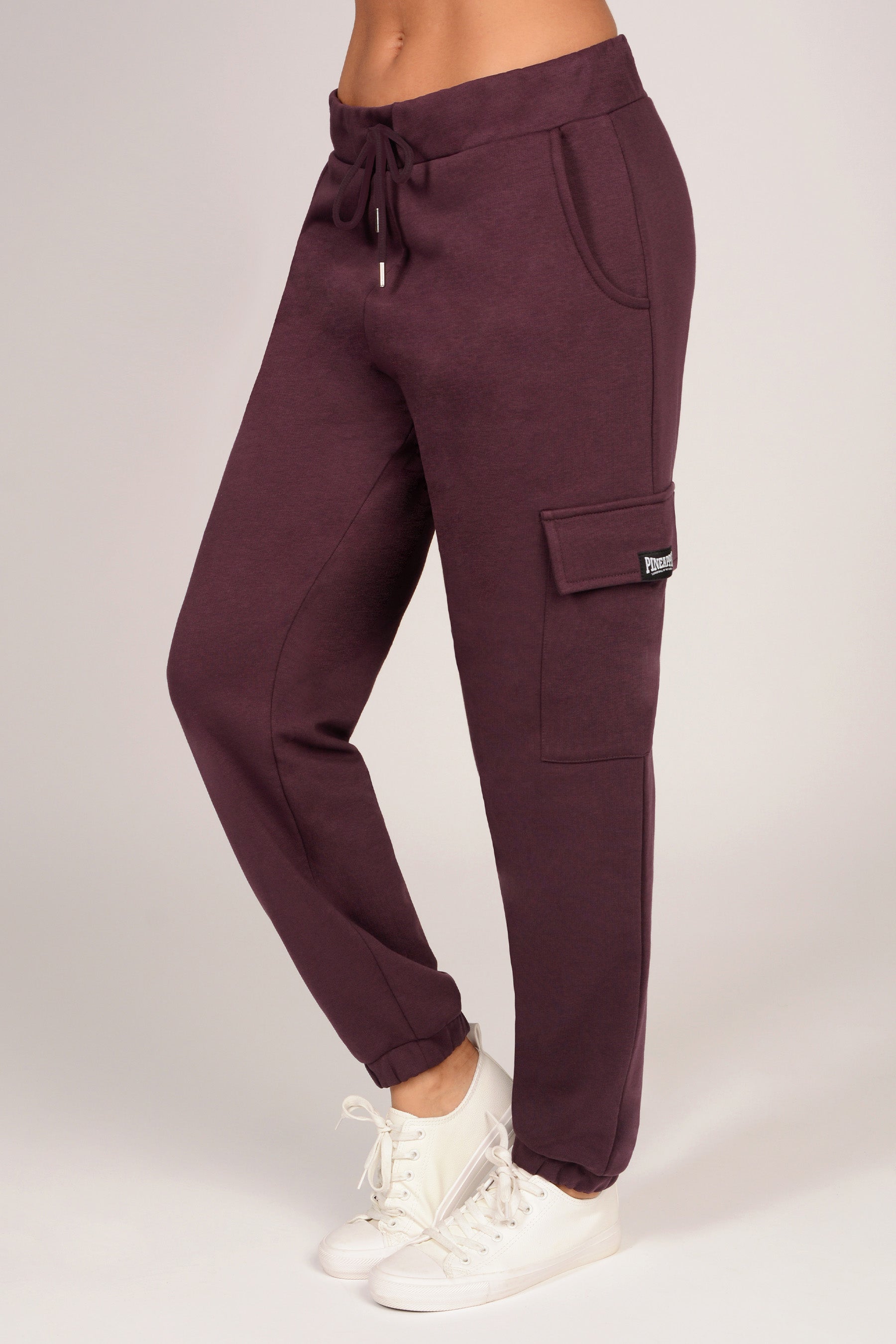 Women's maroon joggers with cargo pockets on a white background