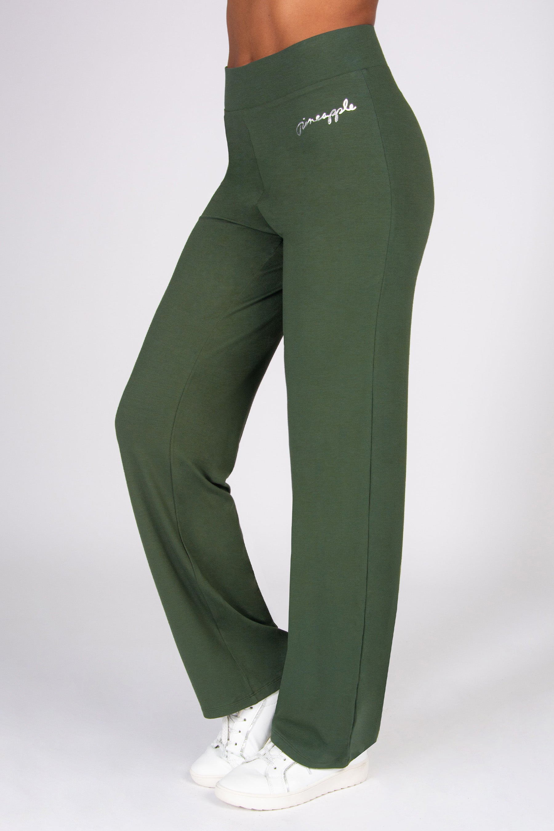 Khaki yoga trousers with wide waistband on a white background