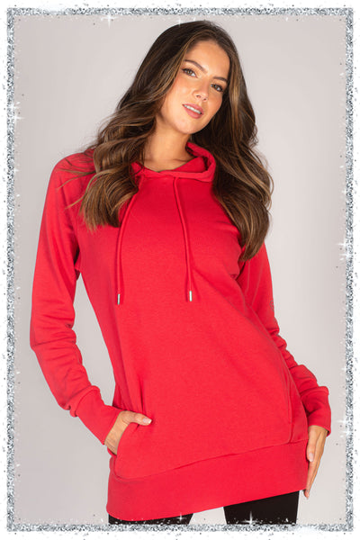 Woman wearing a red hoodie against a plain background