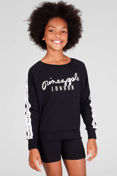 Girl wearing Pineapple Jacquard Sweat Top and black cycling shorts