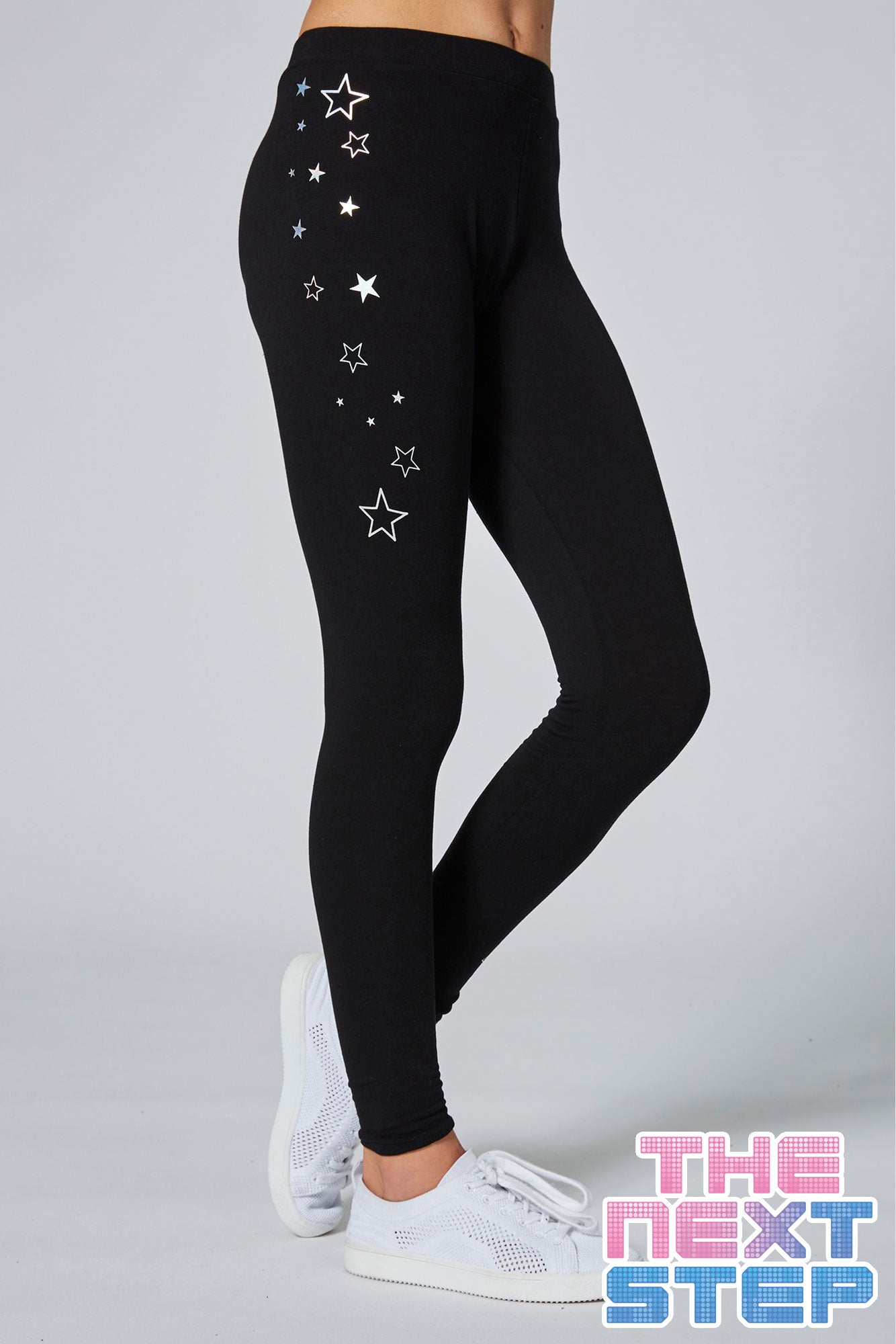 Girl wearing Pineapple x The Next Step Black Star Leggings