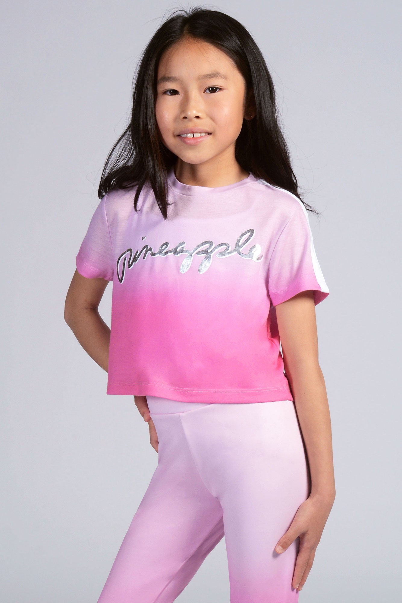 Girl wearing pink Ombré T-Shirt with silver logo
