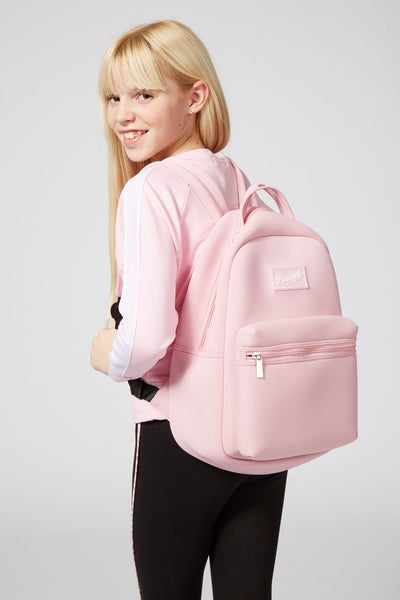 Girl carrying Pineapple Dance Pink Neoprene Backpack
