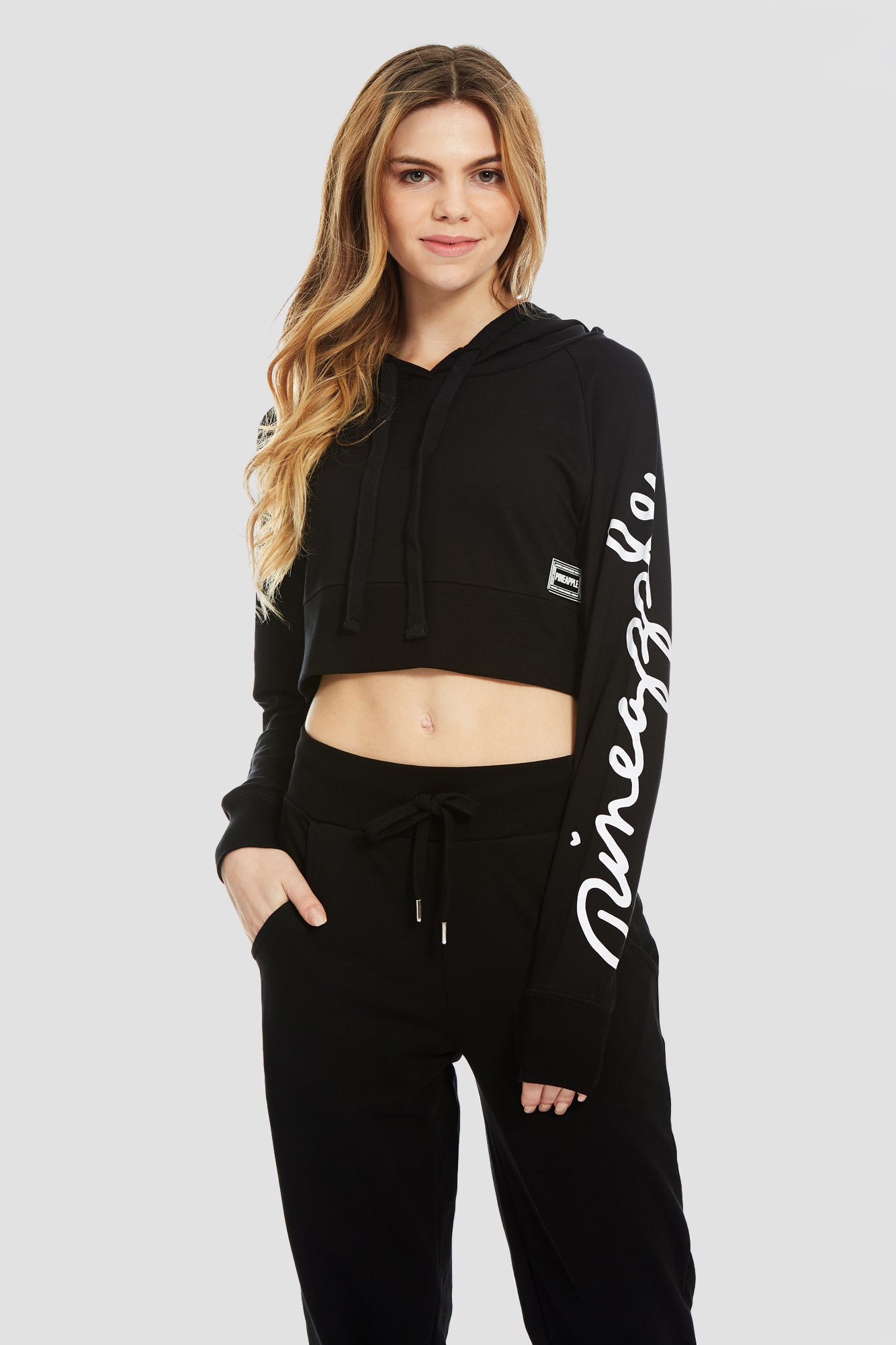Woman wearing Pineapple Black Script Crop Hoodie Black