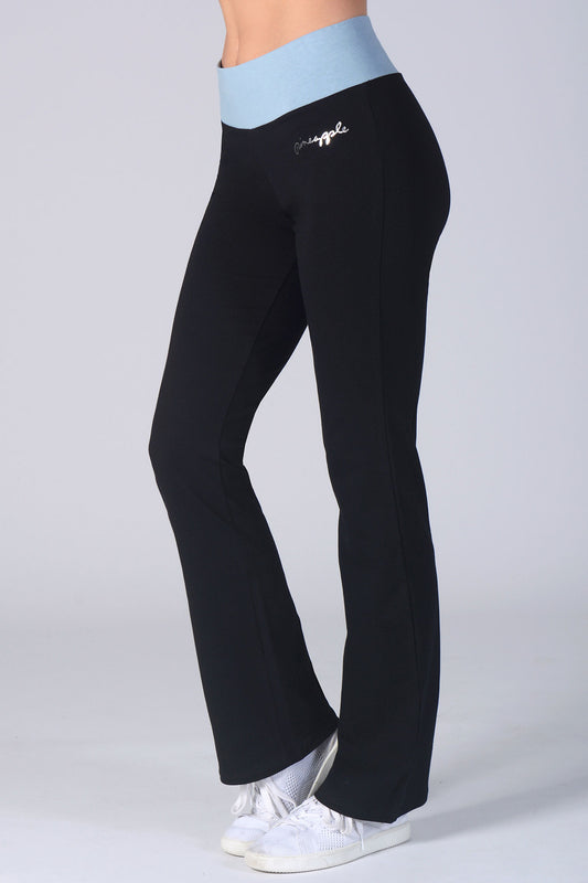 Woman wearing Pineapple black Contrast Band Jersey Trousers with blue waistband