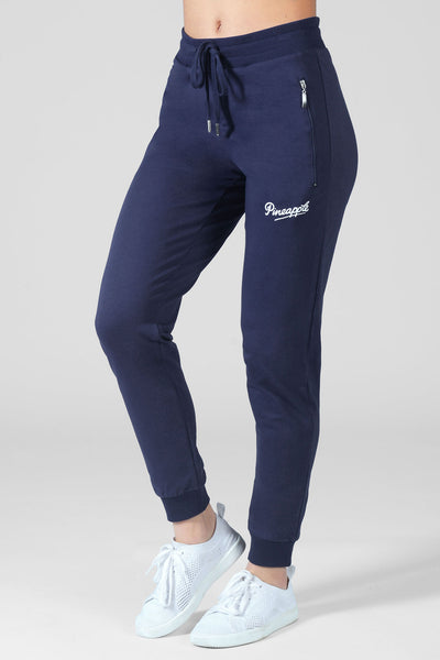 Woman wearing Pineapple navy blue Zip Skinny Joggers